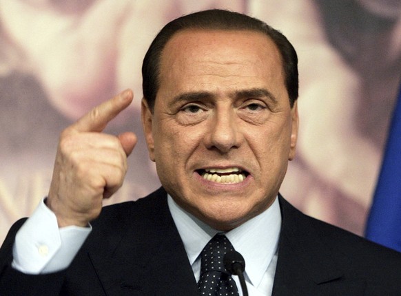 FILE - Italian Premier Silvio Berlusconi gestures as he delivers his speech during a press conference in Rome's Chigi palace Premier's office, Thursday, April 6, 2006. Berlusconi, the boastf ...
