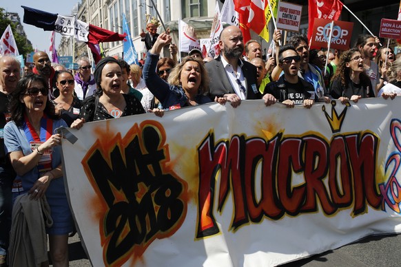 Protesters chant slogans as they rally in Paris, France, Saturday, May 5, 2018. Activists are calling for calm Saturday as the French capital prepares for a what they are calling a mass &quot;party&qu ...