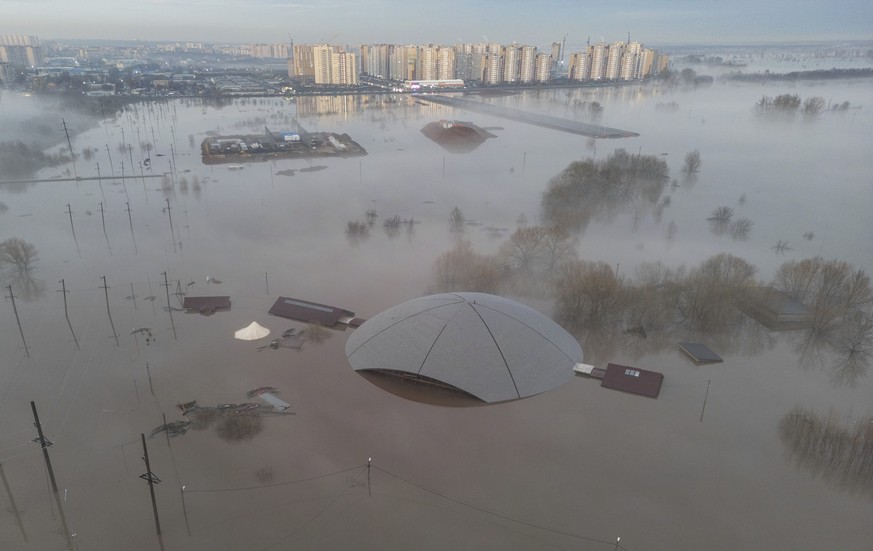 epa11270810 April 10, 2024 An aerial photo taken by a drone shows a flooded residential area in the Orenburg suburb of Orenburg region, Russia on April 10, 2024.  The water level of the Ural River continues to rise