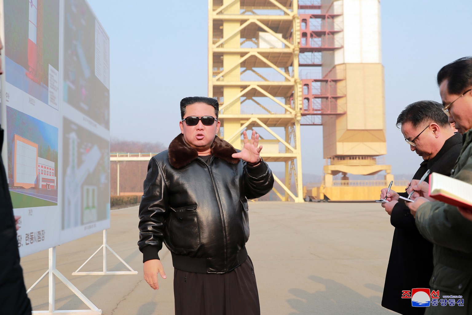 epa09816474 An undated photo released by the official North Korean Central News Agency (KCNA) shows Kim Jong Un (C), general secretary of the Workers' Party of Korea (WPK) and president of the St ...