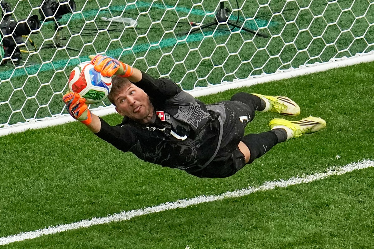 Switzerland goalkeeper Gregor Kobel (1) blocks a penalty shot by Colombia's Cucho Hernandez in a shootout during the World Cup round of 16 soccer match in Vancouver, British Columbia, Tuesday, Ju ...