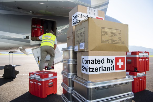 epa07069334 The Swiss Humanitarian Aid Unit (SHA) is preparing to depart for Sulawesi at Bern Belp airport, in Belp, Switzerland, 04 October 2018. After the advance detachment, which has been in Indon ...