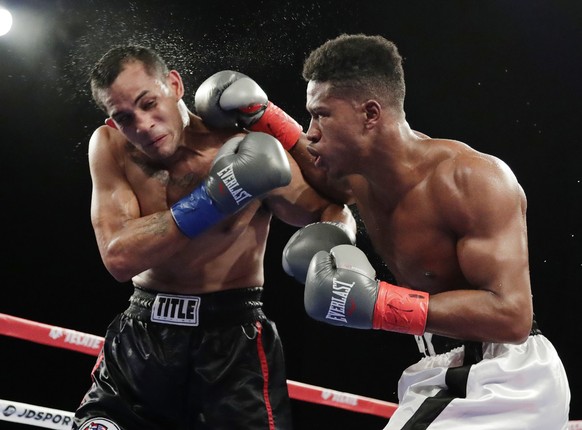 Patrick Day, right, punches Elvin Ayala during the fifth round of a WBC Continental Americas super welterweight championship boxing match Saturday, Oct. 27, 2018, in New York. Day won the fight. (AP P ...