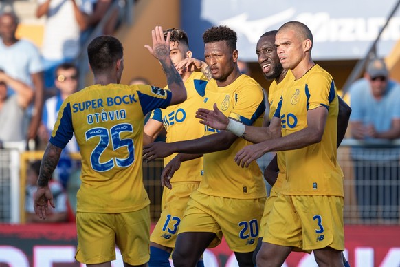 epa07845281 Ze Luis (C) of FC Porto celebrates after scoring during the Portuguese First League soccer match between Portimonense and FC Porto held at stadium Municipal de Portimao, in Portimao, Portu ...