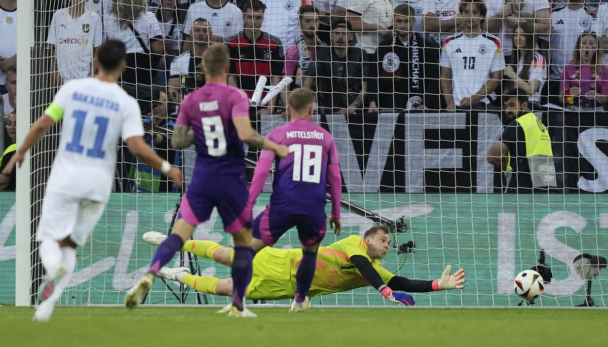 Germany's Goalkeeper Manuel Neuer jumps for the ball during the international friendly soccer match between Germany and Greece at the Borussia Park in Moenchengladbach, Germany, Friday, June 7, 2 ...