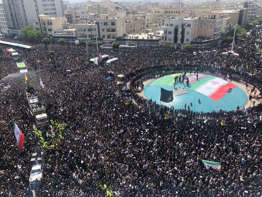 epa11359603 Iranians take part in a funeral ceremony for late president Ebrahim Raisi in Tehran, Iran, 22 May 2024. Iranian president Raisi and seven others, among them foreign minister Amir-Abdollahi ...