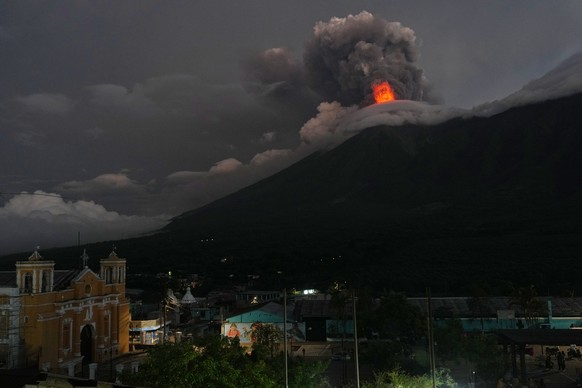 KEYPIX - Lava flows and clouds of ash out of the crater of the Fuego Volcano, as seen from San Juan Alotenango, Guatemala, Tuesday, Aug. 4, 2026. (AP Photo/Moises Castillo)
