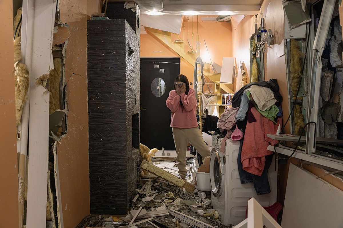 KYIV, UKRAINE - OCTOBER 22: Natalya reacts as she looks at the damage inside her house following an aerial attack on October 22, 2026 in Kyiv, Ukraine. According to initial reports, Russia fired aroun ...