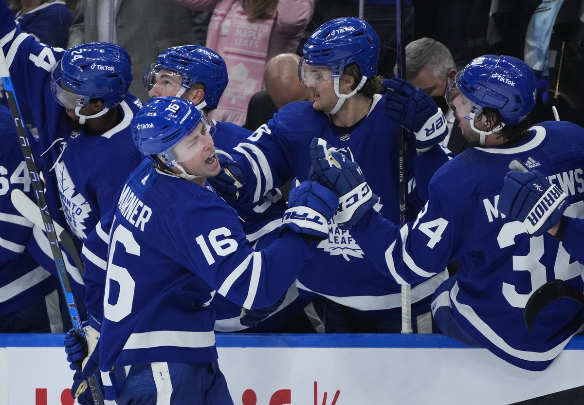 Toronto Maple Leafs forward Mitchell Marner (16) celebrates his goal with teammates after scoring against the Detroit Red Wings during third-period NHL hockey game action in Toronto, Saturday, Oct. 30 ...