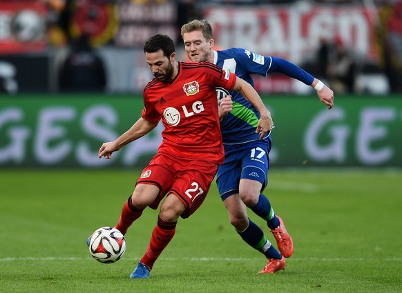 LEVERKUSEN, GERMANY - FEBRUARY 14: Gonzalo Castro of Bayer Leverkusen is chased by Andre Schuerrle of VfL Wolfsburg during the Bundesliga match between Bayer 04 Leverkusen and VfL Wolfsburg at BayAren ...