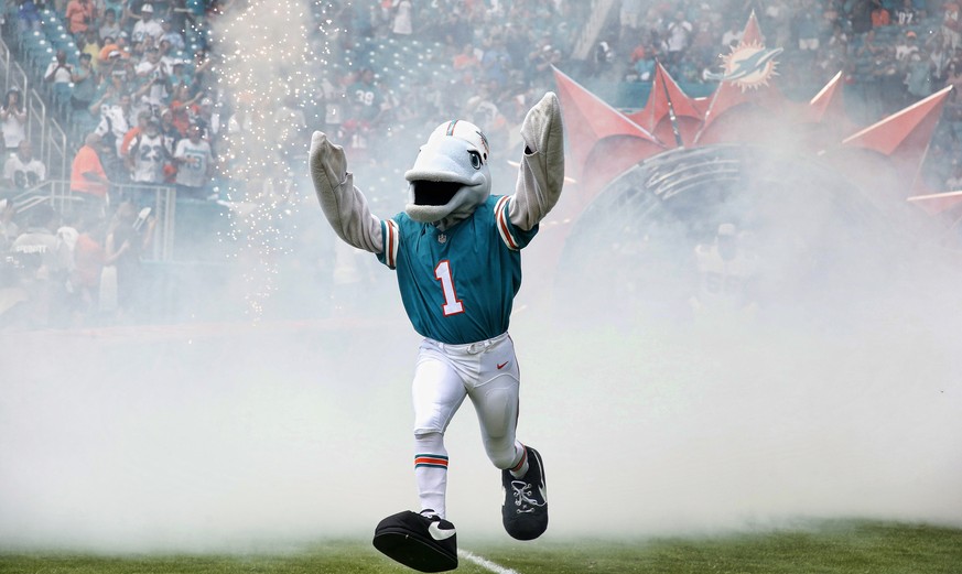 epa07845309 The Miami Dolphins mascot, TD, enters the field before the NFL game between the New England Patriots and the Miami Dolphins at Hard Rock Stadium in Miami, Florida USA 15 September 2019. EP ...