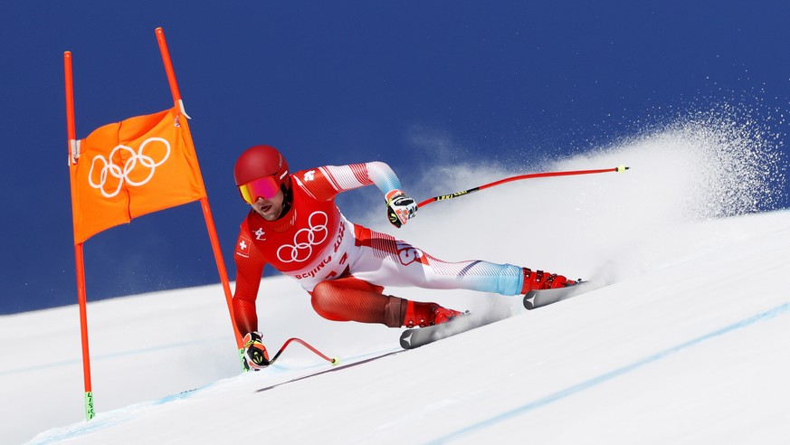 epa09726597 Niels Hintermann of Swizerland in action during the 2nd training run for the Men's Downhill race of the Alpine Skiing events of the Beijing 2022 Olympic Games at the Yanqing National  ...