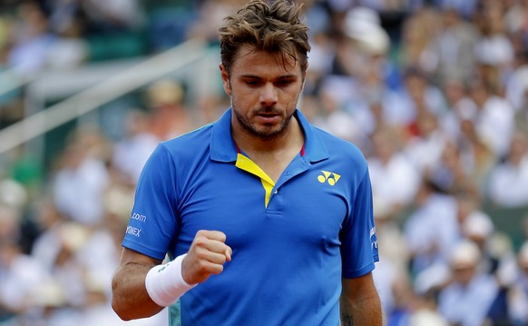 epa06019014 Stanislas Wawrinka of Switzerland reacts as he plays against Andy Murray of Britain during their men’s singles semi final match during the French Open tennis tournament at Roland Garros in ...