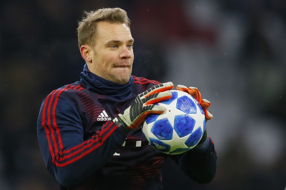 Bayern goalkeeper Manuel Neuer warms up prior to the Champions League group E soccer match between Ajax and FC Bayern Munich at the Johan Cruyff Arena in Amsterdam, Netherlands, Wednesday, Dec. 12, 20 ...