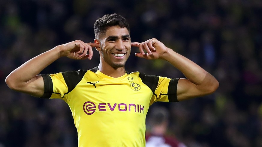 epa07049614 Dortmund&#039;s Jadon Sancho (R) celebrates with his teammate Achraf Hakimi (L) after scoring the 6-0 lead during the German Bundesliga soccer match between Borussia Dortmund and FC Nuernb ...