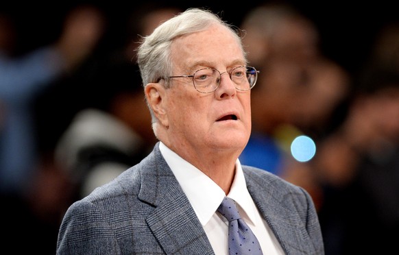 epa07787884 (FILE) - David H. Koch, then executive vice president and a board member of Koch Industries,. Inc., watches the New York Knicks playing the Miami Heat at Madison Square Garden in New York, ...