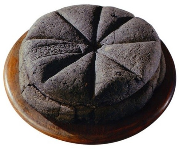 A preserved loaf of bread discovered at Herculaneum, with impression of a similar stamp shown at top (mid 1st century AD).
See: Andrew Wallace- Hadrill, Herculaneum, Francis Lincoln Ltd, 2011, p. 244. ...