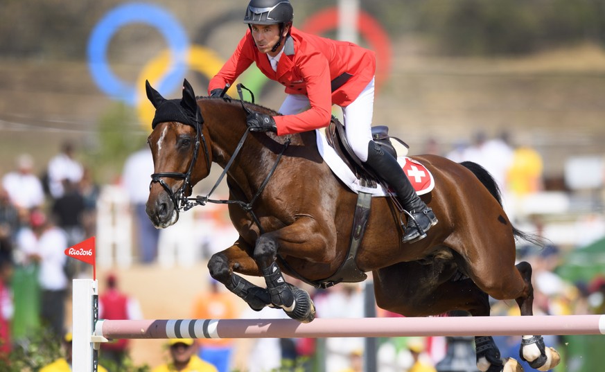 Steve Guerdat of Switzerland rides his horse Nino des Buissonnets during the Equestrian Jumping individual and team qualifier in the Olympic Equestrian Centre in Rio de Janeiro, Brazil, at the Rio 201 ...