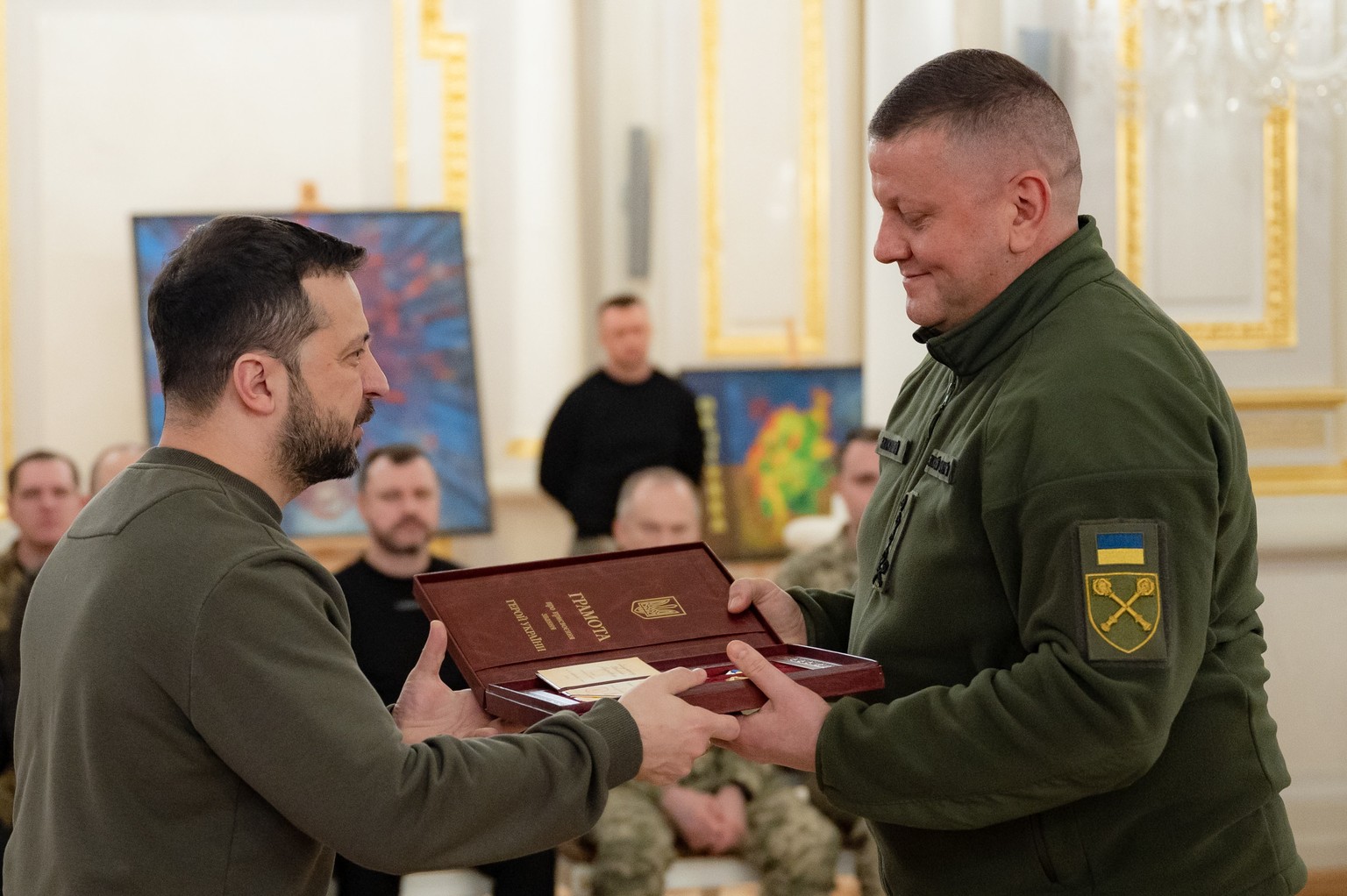 epa11139519 A handout picture made available by the Presidential Press Service shows Ukrainian President Volodymyr Zelensky (L) awarding Commander-in-Chief Valerii Zaluzhnyi (R) with the Order of the  ...