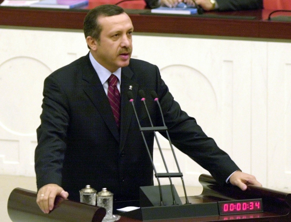 Turkey's Prime Minister Recep Tayyip Erdogan addresses the Parliament in Ankara Sunday, March 23, 2003 after his government won a vote of confidence. Erdogan's nine-day old government won th ...