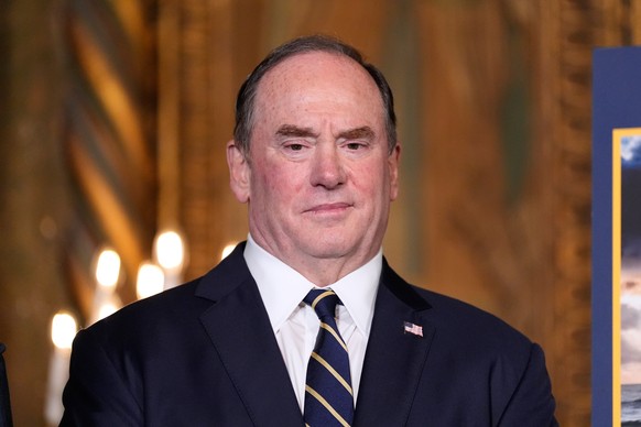 FILE - Secretary of the Navy John Phelan listens as President Donald Trump speaks at his Mar-a-Lago club, Dec. 22, 2025, in Palm Beach, Fla. (AP Photo/Alex Brandon, file)
John Phelan