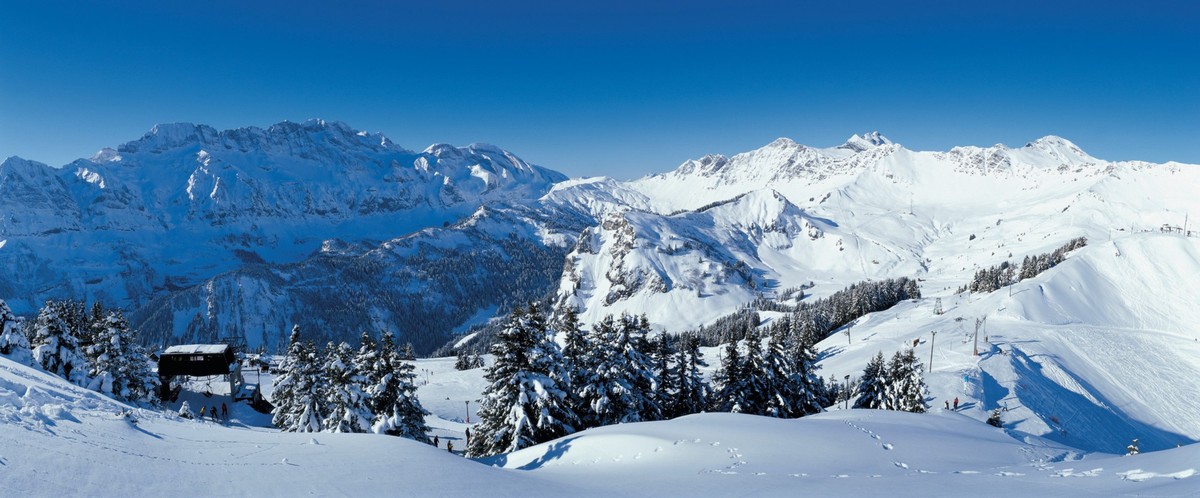 Your holiday. Switzerland. Panorama view of the international skiing area Portes du Soleil above Champery in Canton Valais (1064 m). Endlich Ferien. Ihre Schweiz. Panoramasicht auf das international ...