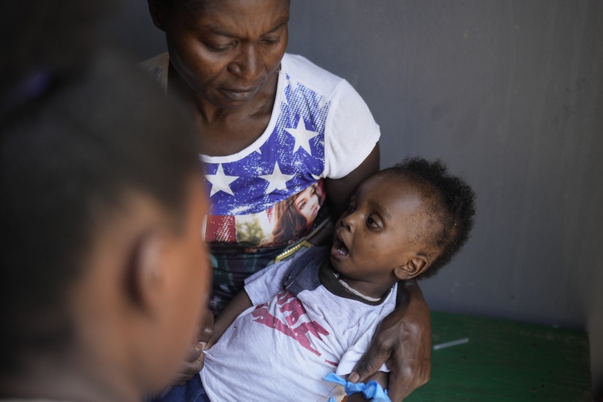 A boy with Cholera symptoms is attended at the Fontaine Hospital Center which treats malnourished children in the Cite Soleil neighborhood of Port-au-Prince, Haiti, Monday, May 29, 2023. Two U.N. agen ...