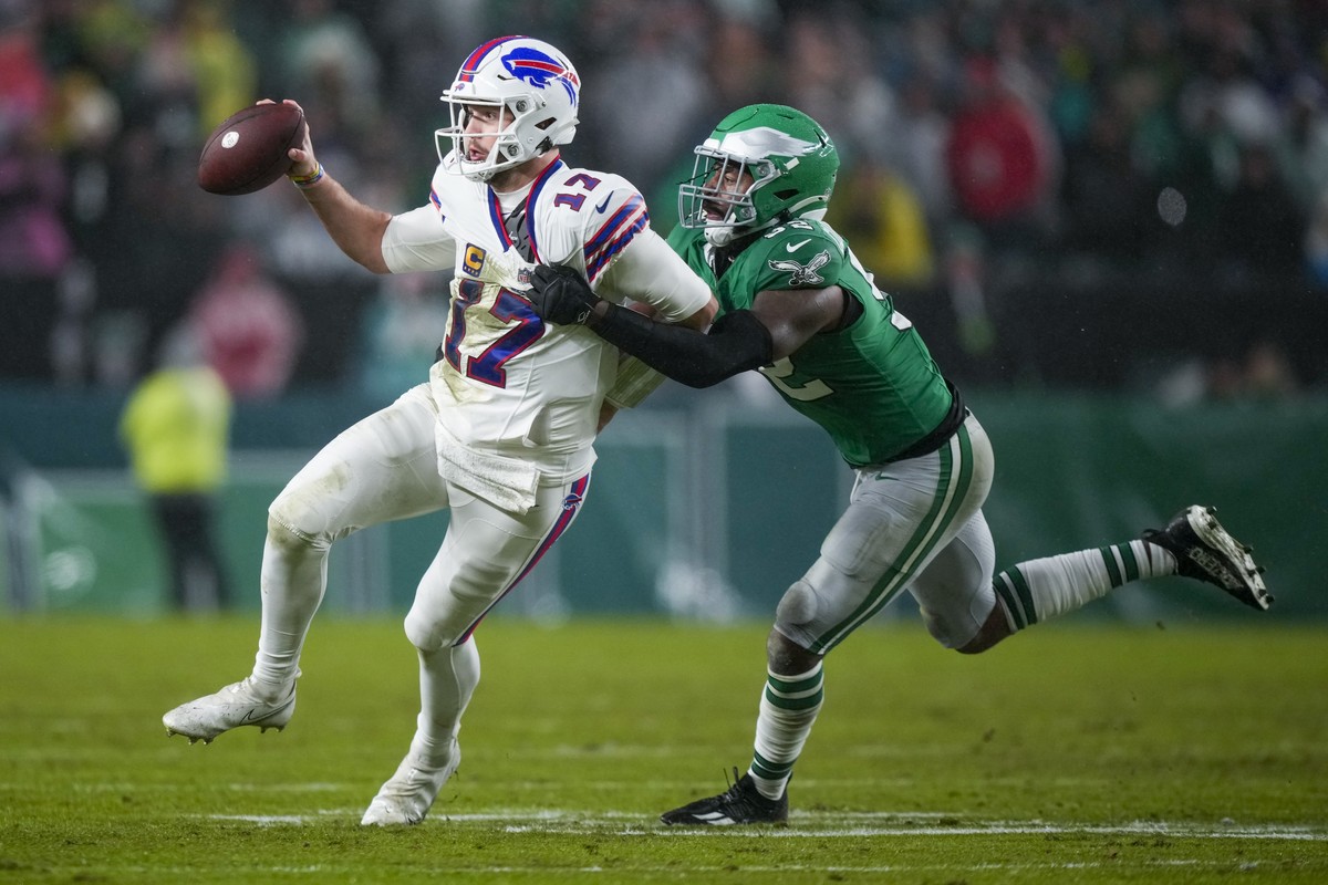 Buffalo Bills quarterback Josh Allen is tackled by Philadelphia Eagles linebacker Zach Cunningham during the first half of an NFL football game Sunday, Nov. 26, 2023, in Philadelphia. (AP Photo/Matt S ...