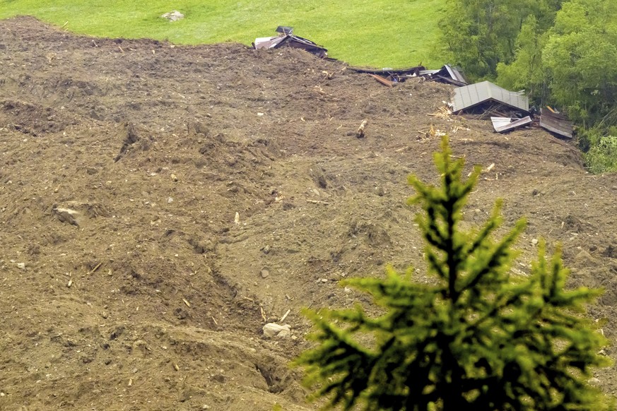 A large avalanche with a mixture of ice, rock, snow and water reach the valley floor is pictured in Wiler after the Birch glacier collapsing above Blatten, Switzerland, Wednesday, May 28, 2025. (Jean- ...