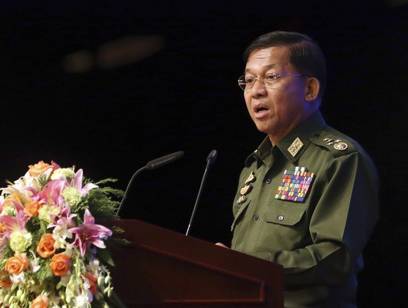 Myanmar&#039;s Army Commander Senior Gen. Min Aung Hlaing speaks during the second anniversary of the signing of nationwide ceasefire agreement (NCA) at the Myanmar International Convention Center in  ...