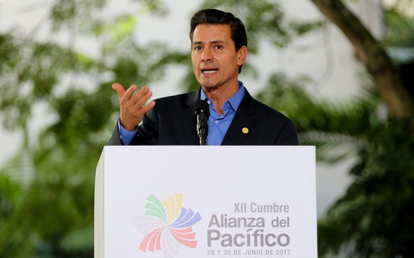 epa06058798 President of Mexico, Enrique Pena Nieto, speaks during the final press conference of the XII Pacific Alliance Summit in Cali, Colombia, 30 June 2017. The presidential meeting of the 12th S ...