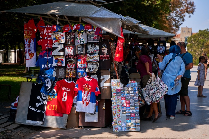 A street souvenir stall in Belgrade sells Russian symbols and Putin T-shirts. Belgrade, Serbia - 08.26.2022