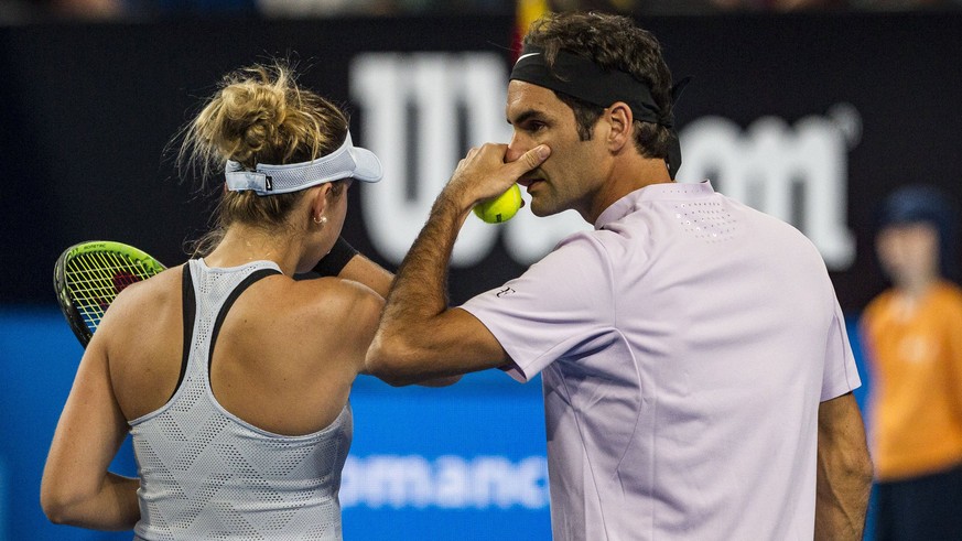 epa06420169 Belinda Bencic and Roger Federer of Switzerland in action during final mixed doubles match between Belinda Bencic with Roger Federer of Switzerland and Angelique Kerber with Alexander Zver ...