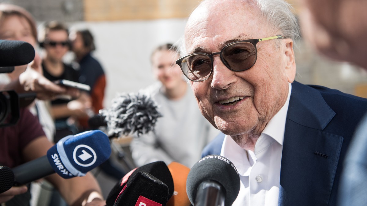 epa10058658 The former president of the World Football Association (FIFA), Joseph Blatter, is surrounded by media representatives, as he gives statements at the last day of his trial, when the verdict ...