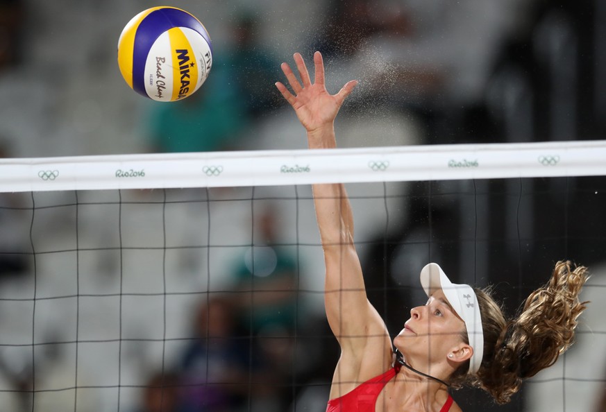 Switzerland&#039;s Nadine Zumkehr spikes a ball during a women&#039;s beach volleyball match against Germany at the 2016 Summer Olympics in Rio de Janeiro, Brazil, Sunday, Aug. 7, 2016. (AP Photo/Petr ...