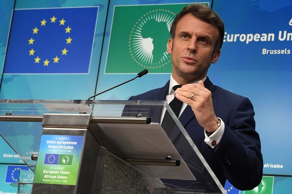 epa09769489 French President Emmanuel Macron speaks during a press conference on the second day of an European Union (EU) African Union (AU) summit at the European Council Building in Brussels, Belgiu ...