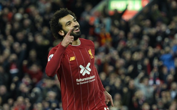 epa07954445 LiverpoolÄôs Mohamed Salah celebrates after scoring the 2-1 goal during the English Premier League game between Liverpool FC and Tottenham Hotspur in Liverpool, Britain, 27 October 2019. ...