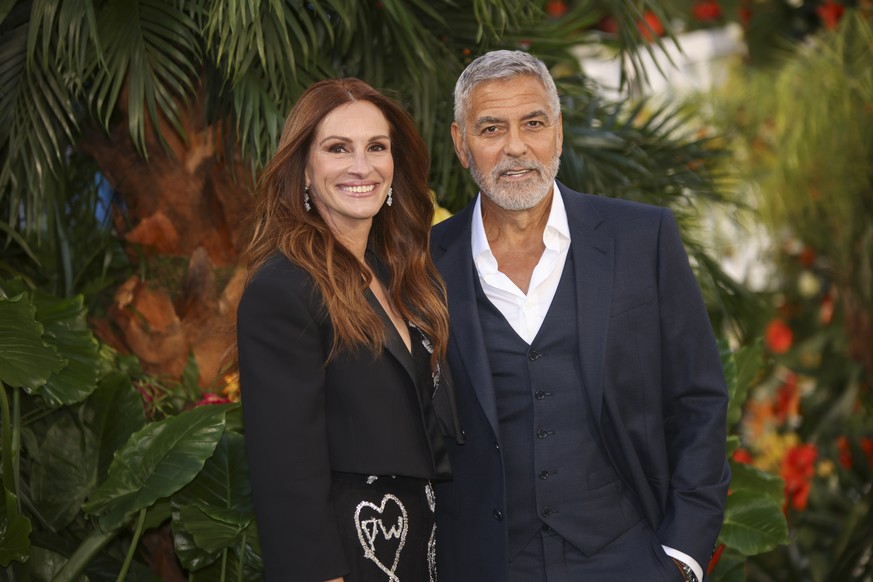 Julia Roberts, left, and George Clooney pose for photographers upon arrival for the World premiere of the film &#039;Ticket To Paradise&#039; in London, Wednesday, Sept. 7, 2022. (Photo by Vianney Le  ...