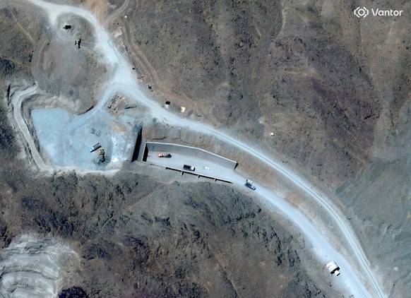 This satellite image provided by Vantor shows vehicles at the western tunnel entrance at Pickaxe Mountain, June 21, 2026. (Satellite image ©2026 Vantor via AP)
Iran US War