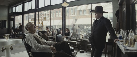This image released by Apple TV+ shows Robert De Niro, left, and Jesse Plemons in a scene from &quot;Killers of the Flower Moon.&quot; (Melinda Sue Gordon/Apple TV+ via AP)