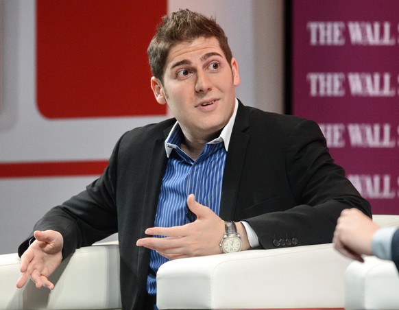 Facebook co-founder Eduardo Saverin speaks during the Wall Street Journal Unleashing Innovation executive conference held at Capella Singapore, Sentosa Island in Singapore on February 21, 2013. The Si ...