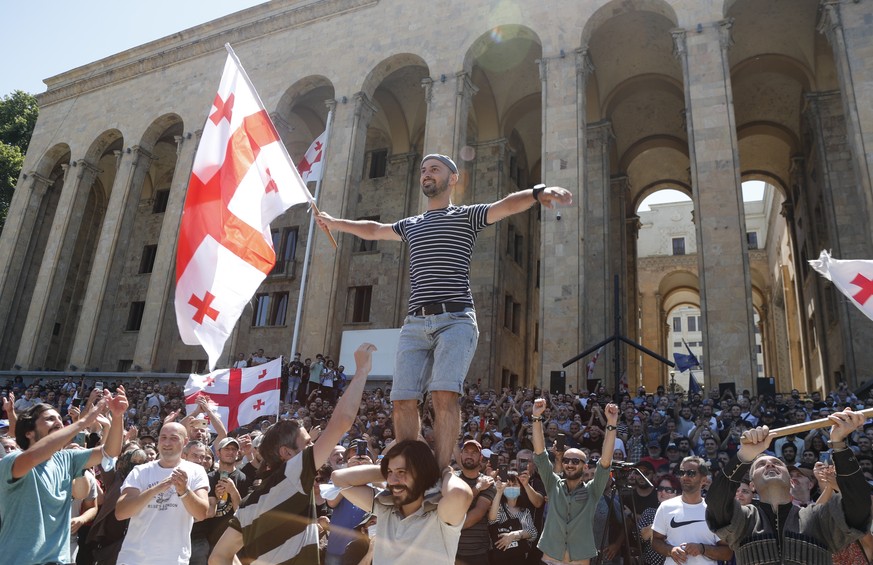 epa09323813 Georgians attend a rally to protest against LGBT community activities in Tbilisi, Georgia, 05 July 2021. Organizers of Tbilisi 2021 Pride March, scheduled for 05 July, cancelled the event  ...