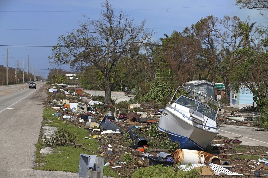 Debris from Hurricane Irma lays on the side of the Overseas Highway in Islamorda in the Florida Keys on Monday, Sept. 11, 2017, as Hurricane Irma passes. (Charles Trainor Jr/Miami Herald via AP)