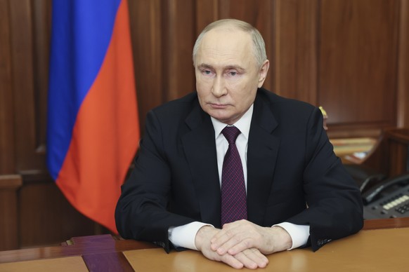 Russian President Vladimir Putin addresses voters in the 2024 presidential election at the Kremlin, in Moscow, Russia, Thursday, March 21, 2024. (Mikhail Metzel, Sputnik, Kremlin Pool Photo via AP)