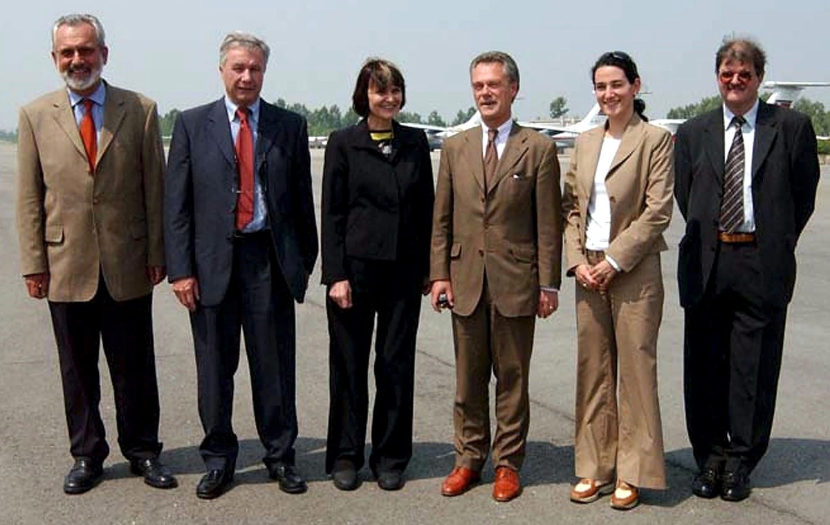 Swiss Foreign Minister Micheline Calmy-Rey, 3rd left, stands with unidentified members of a Swiss delegation on the tarmac of Sunan Airport after arriving in Pyongyang, North Korea, Friday 16 May 2003 ...
