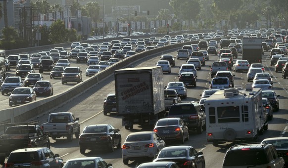 FILE - This Sept. 9, 2016 file photo shows rush hour traffic moving along the Hollywood Freeway in Los Angeles. The city long known for its sprawl and glacial traffic is fighting over what it should b ...