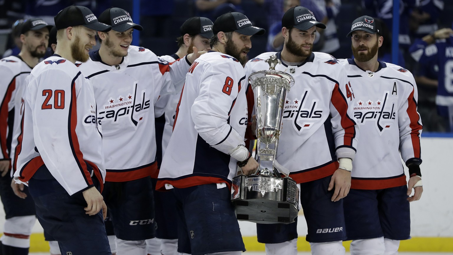 Washington Capitals left wing Alex Ovechkin (8) holds the Prince of Wales trophy with teammates after the Capitals defeated the Tampa Bay Lightning 4-0 during Game 7 of the NHL Eastern Conference fina ...