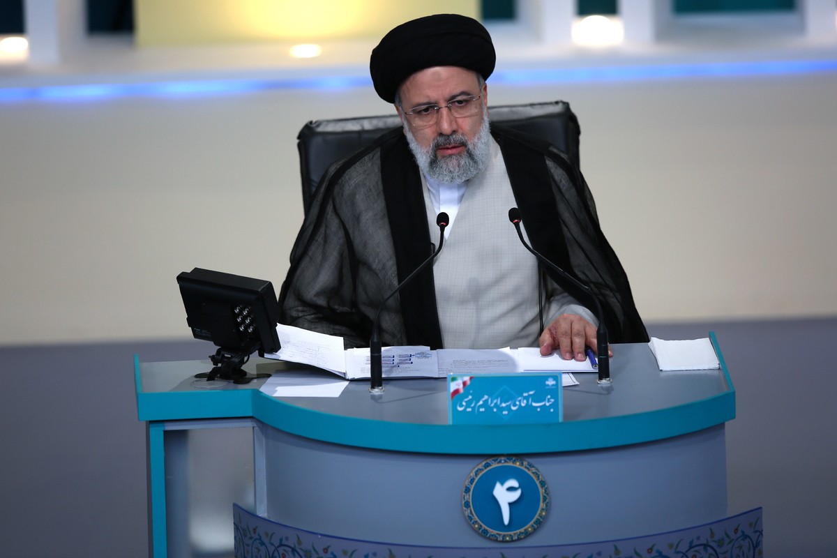 epa09265517 A handout photo made available by the Iranian Young Journalist Club (YJC) shows, Iranian presidential candidates, Ebrahim Raisi during the last televised debate between Iran presidential c ...