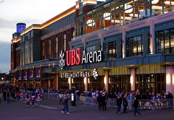 FILE - Fans wait to enter the new UBS Arena for the first New York Islanders NHL hockey game against the Calgary Flames, on Nov. 20, 2021, in Elmont, N.Y. (AP Photo/Adam Hunger, File)
FILE