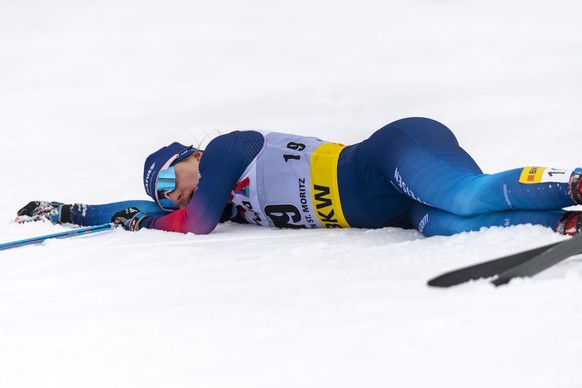 epa09073276 Nadine Faehndrich of Switzerland after crossing the finish line of the women&#039;s 30 km FIS Cross-Country Skiing World Cup race in S-Chanf, Switzerland, 14 March 2021. EPA/GIAN EHRENZELL ...